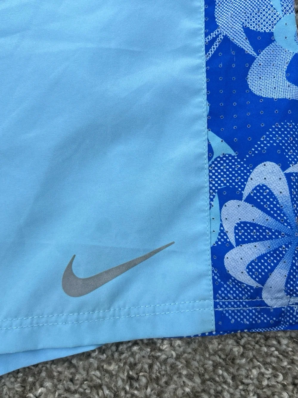 Nike girl’s Light Blue Athletic Shorts with Dark Blue Floral Panels